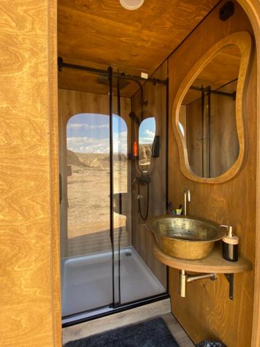 a bathroom with a sink and a mirror at Remote. Forgotten Rivers in Ak-Say