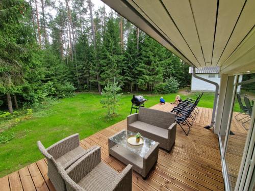 an overhead view of a deck with chairs and a grill at Rõmeda puhkemaja saunaga in Rõmeda