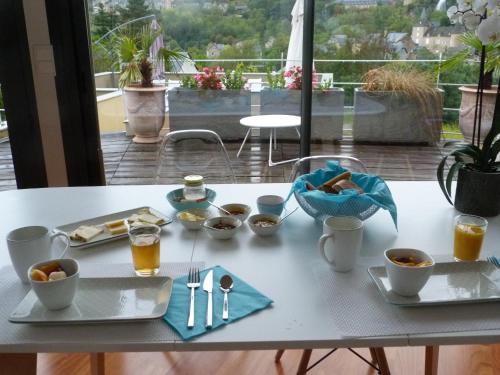 a table with a tray of food and drinks on it at La Désirade in Salles-la-Source
