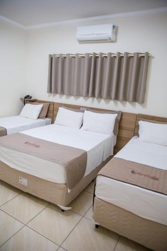 Ένα ή περισσότερα κρεβάτια σε δωμάτιο στο Revitalle Hotel