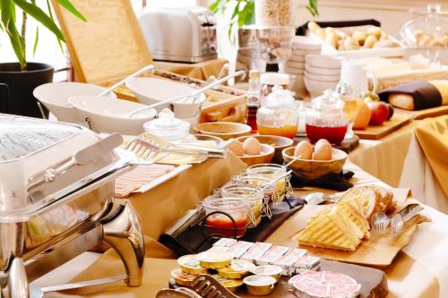 a buffet line with food on a table at Penzión Wellness & Restaurant Zoborská, free parking in Nitra