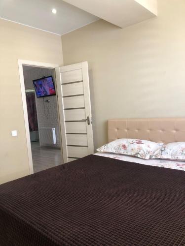 Postel nebo postele na pokoji v ubytování Апартаменты премиум класса