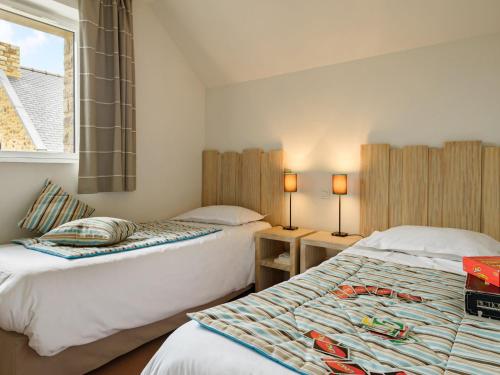 En eller flere senger på et rom på Beautiful luxury apartment near a Breton oyster village