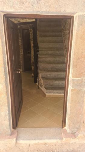 an entrance to a stairway with a door and stairs at Olympus in Olýmpoi
