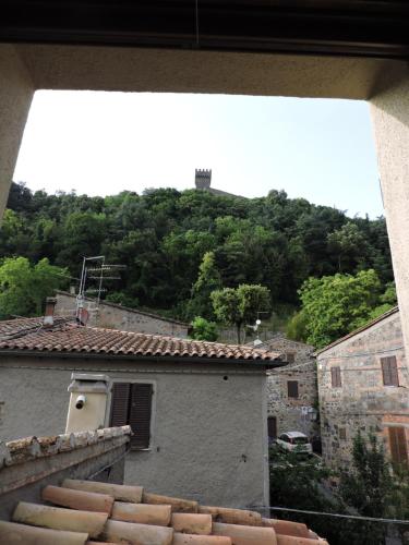 a view of a building with a mountain in the background at La Casa di Olga in Radicofani