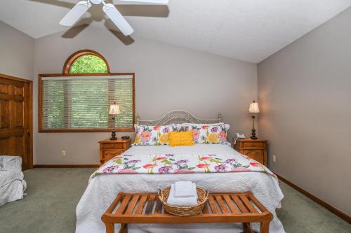 a bedroom with a large bed and a table at Tranquility in McHenry