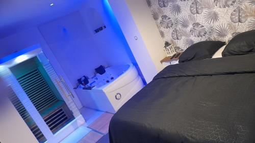 Ένα ή περισσότερα κρεβάτια σε δωμάτιο στο Le spa d ailly