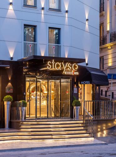 a store with stairs in front of a building at Stayso The House Hotel in Istanbul