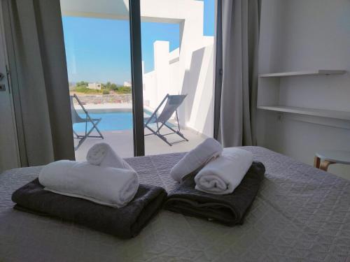 Postel nebo postele na pokoji v ubytování Alpha Villas