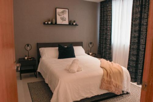Postel nebo postele na pokoji v ubytování Cozy & Coqueto Paraíso Apartament