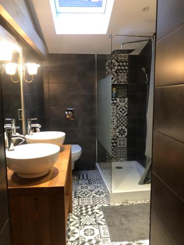 a bathroom with a sink and a shower at SEA-YOU Etaples-Le Touquet in Étaples