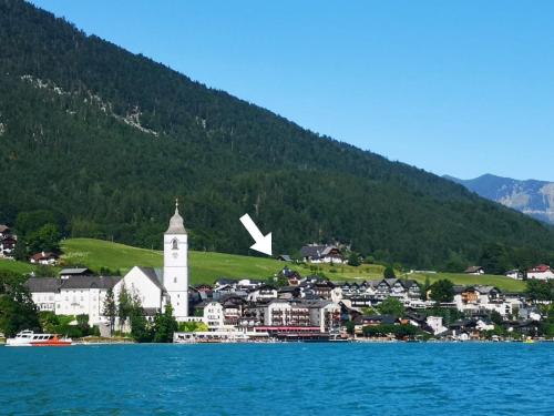 a small town on the shore of a body of water at Villa Franz Xaver in St. Wolfgang