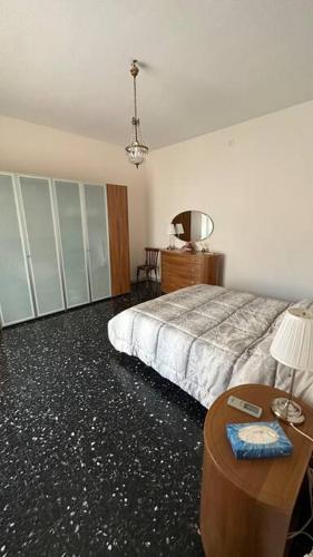a bedroom with a bed and a table with a lamp at B&B Mamma Mia s in Airola