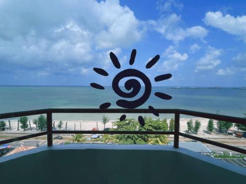 a view of the ocean from the balcony of a condo at Mutiara Melaka Beach Resort by Minso in Tangga Batu