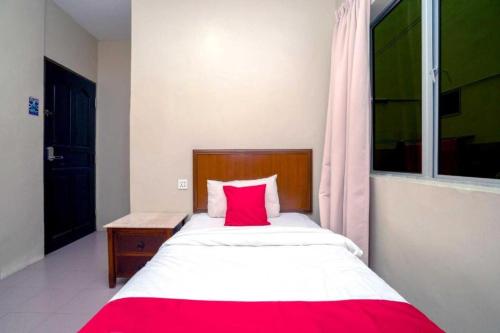 Ein Bett oder Betten in einem Zimmer der Unterkunft Hotel The Island