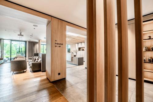 an open hallway with a living room and dining room at Langwies Genussherberge in Hallein