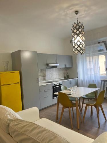 a kitchen and dining room with a table and chairs at La casa delle Sciure in Ferrere