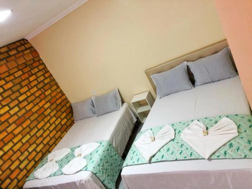 En eller flere senge i et værelse på Riacho do Recanto Pousada
