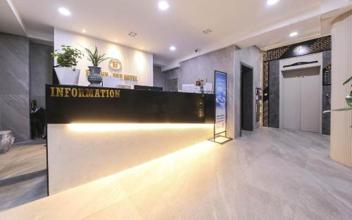 a lobby with a reception desk in a building at Browndot Hotel Gwangju Pungam in Gwangju