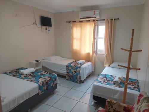 Łóżko lub łóżka w pokoju w obiekcie Riacho do Recanto Pousada