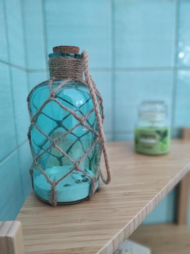 a glass jar with a net on a shelf at Da Marilù in Mazara del Vallo