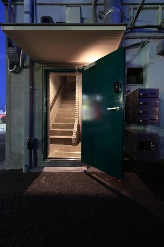 a door leading to a staircase in a building at SHIN kyoto in Kyoto