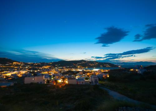 a view of a city at night with lights at Ornos Blue in Ornos