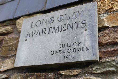 a stone sign on the side of a building at Long Quay Apartments, Clonakilty in Clonakilty