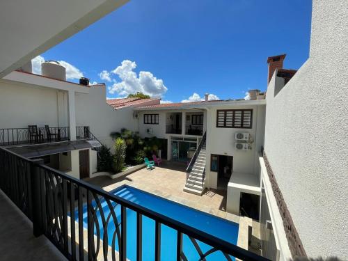 a view from the balcony of a house with a swimming pool at Hotel Las Pascuas in Tarija