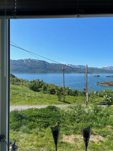 a view of a lake from a window at Bestefarhuset in Hakkstabben