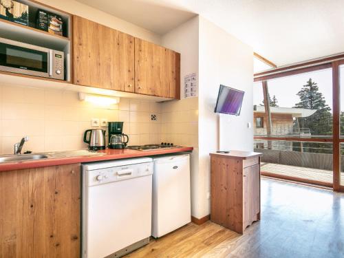 a kitchen with a sink and a dishwasher at V du Bachat - JOUBARDES A15- 6 PERS in Chamrousse