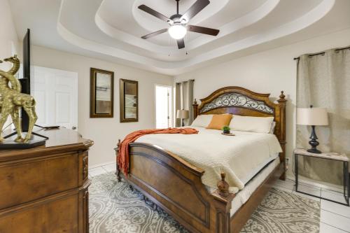 a bedroom with a bed and a ceiling fan at Pet-Friendly Edinburg Apartment with Pool Access! in Edinburg