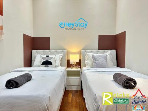 Cama o camas de una habitación en Silver Scape Residence Melaka Raya By Heystay Management