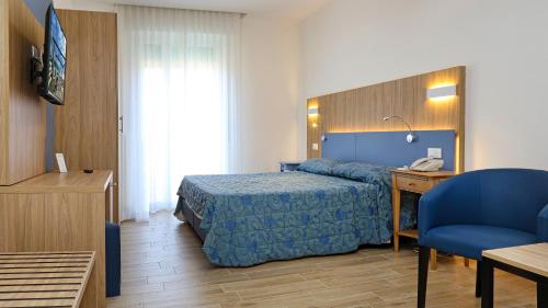 Postel nebo postele na pokoji v ubytování Hotel Marina