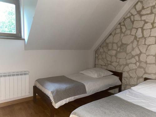 Ένα ή περισσότερα κρεβάτια σε δωμάτιο στο Modrzewiowy Zdrój