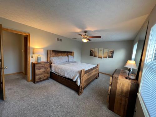 a bedroom with a bed and a ceiling fan at Eat Here, Stay Here, Love It Here! in Pickerington