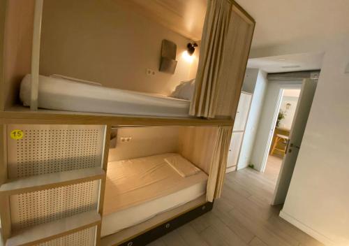 a small room with a bunk bed in it at Blai Blai Hostel in Zarautz