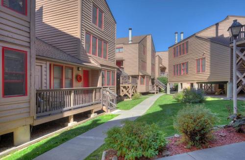 a row of houses with a sidewalk in front of them at 2 2 Ferringway 26 in Durango