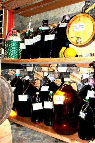 a bunch of bottles of honey on a shelf at ''Aragvi'' hotel in Naghorevi