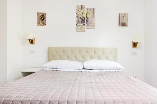 Postel nebo postele na pokoji v ubytování Dual Suites - 4 Posti Letto - Fiumicino Aeroporto e Fiera - Self Check-In