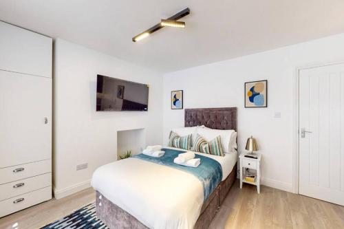 Säng eller sängar i ett rum på Beautiful studio apartment in North Madia Vale