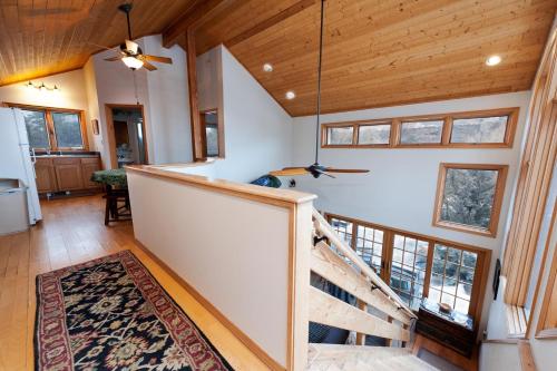 a staircase in a home with wooden ceilings and windows at CR 213 - 2 Bedroom in Durango