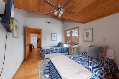 a bedroom with two beds and a ceiling fan at CR 213 - 2 Bedroom in Durango