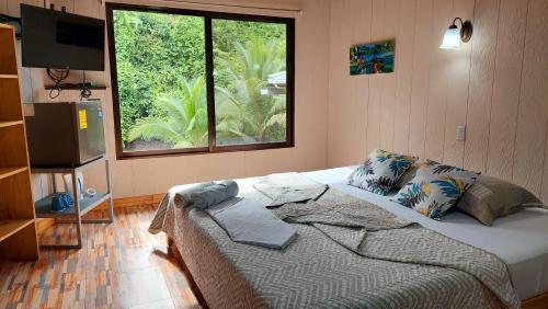 Un pat sau paturi într-o cameră la Casa el Tortugo