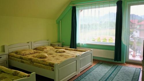 Un pat sau paturi într-o cameră la Casa Flamingo