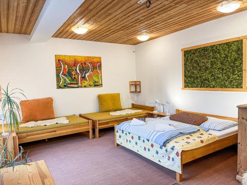 A bed or beds in a room at Apartmány Limba