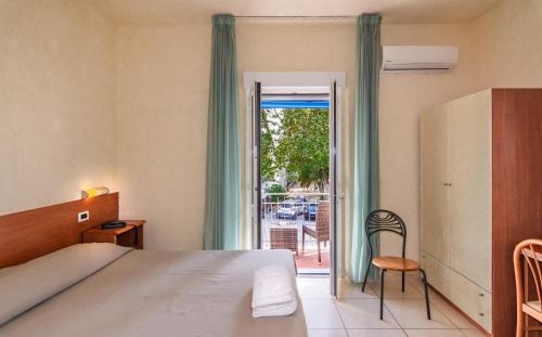 Ένα ή περισσότερα κρεβάτια σε δωμάτιο στο Hotel Daisy
