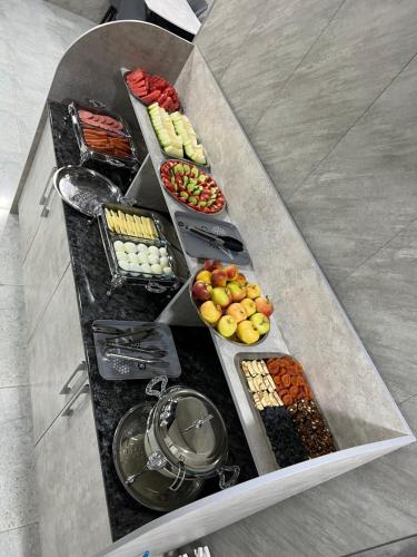 a tray of different types of food on a table at ReveL HoteL in Tashkent