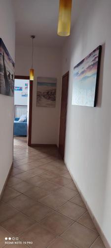 a hallway with two pictures on the walls of a room at Il Tulipano in Sorrento