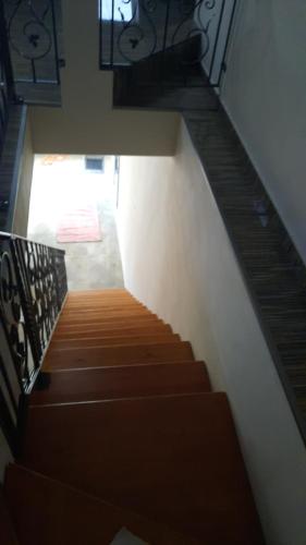 a view of a stairway with a wooden staircase at City Grand Apartman in Szombathely
